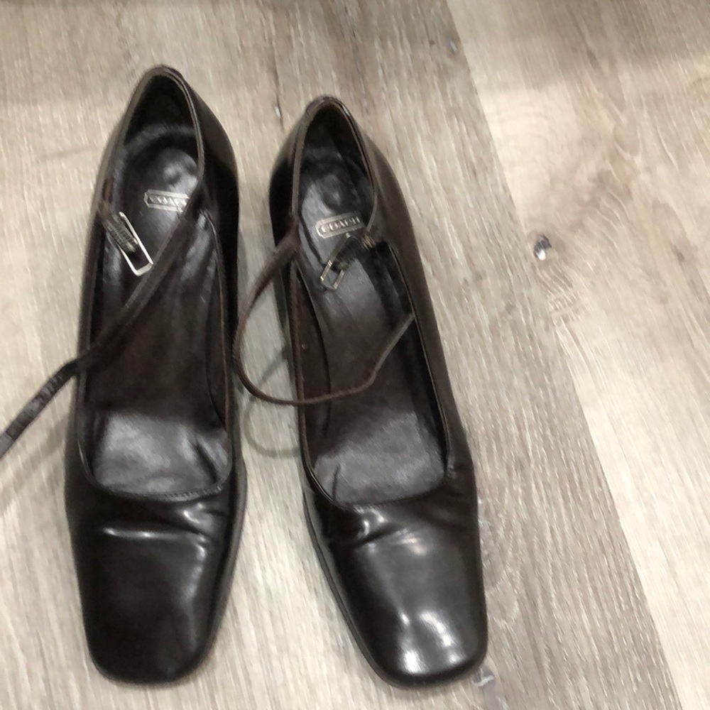 Dark chocolate Coach shoes heel is 2”